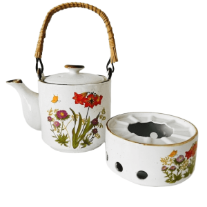 Vintage keramische theepot en warmer wilde bloemen rustiek retro 1970’s